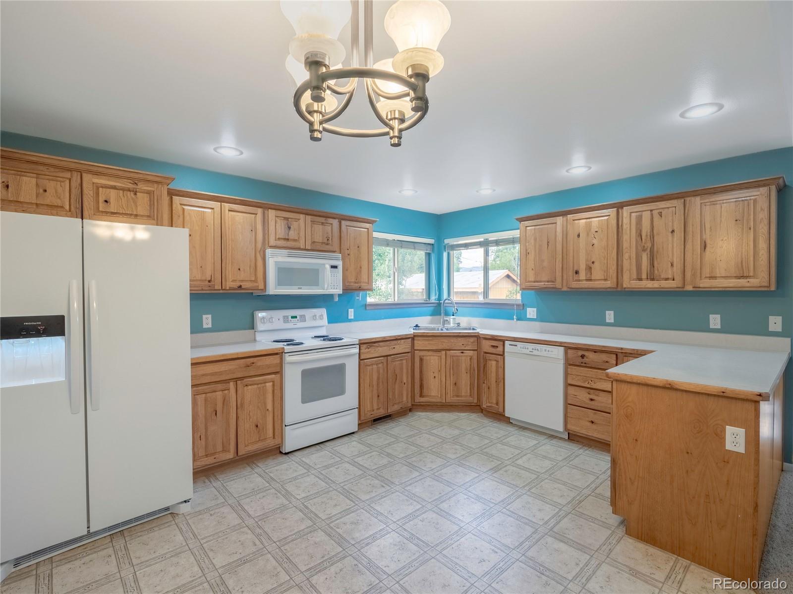 1436 H Street, Unit D Salida, CO 81201 - Photo 10 of 31 a kitchen with granite countertop stainless steel appliances a sink and cabinets