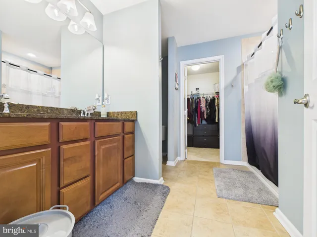 a view of hallway with chandelier