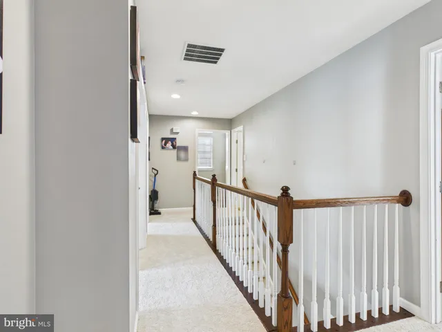 a view of a hallway with a white walls