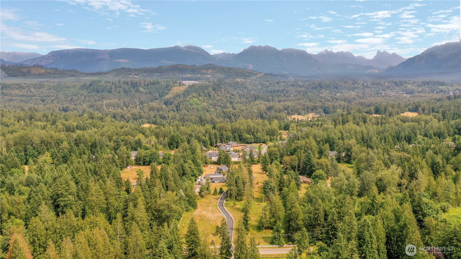 12523 Woods Lake Road Monroe, WA 98272 - Photo 34 of 40 a view of a town with mountains in the background