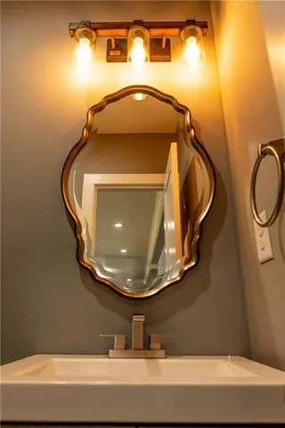 a kitchen with stainless steel appliances granite countertop a refrigerator a stove and a wooden floors