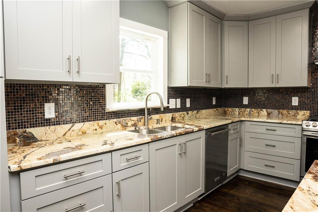 1433 Merriman Lane Northeast Atlanta, GA 30324 - Photo 16 of 60 a kitchen with cabinets appliances and a window