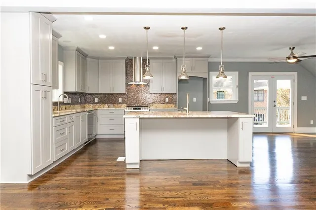 a view of an entryway with wooden floor