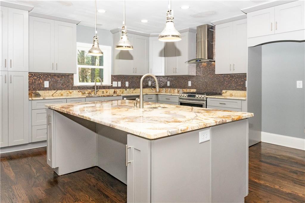1433 Merriman Lane Northeast Atlanta, GA 30324 - Photo 20 of 60 a kitchen with kitchen island granite countertop a sink and cabinets