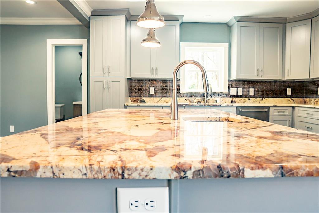1433 Merriman Lane Northeast Atlanta, GA 30324 - Photo 24 of 60 a bathroom with a sink mirror and