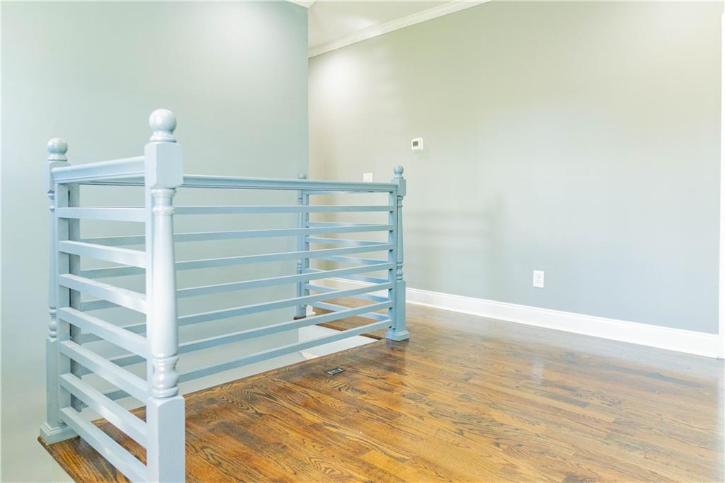 1433 Merriman Lane Northeast Atlanta, GA 30324 - Photo 28 of 60 a view of walk in closet with empty racks