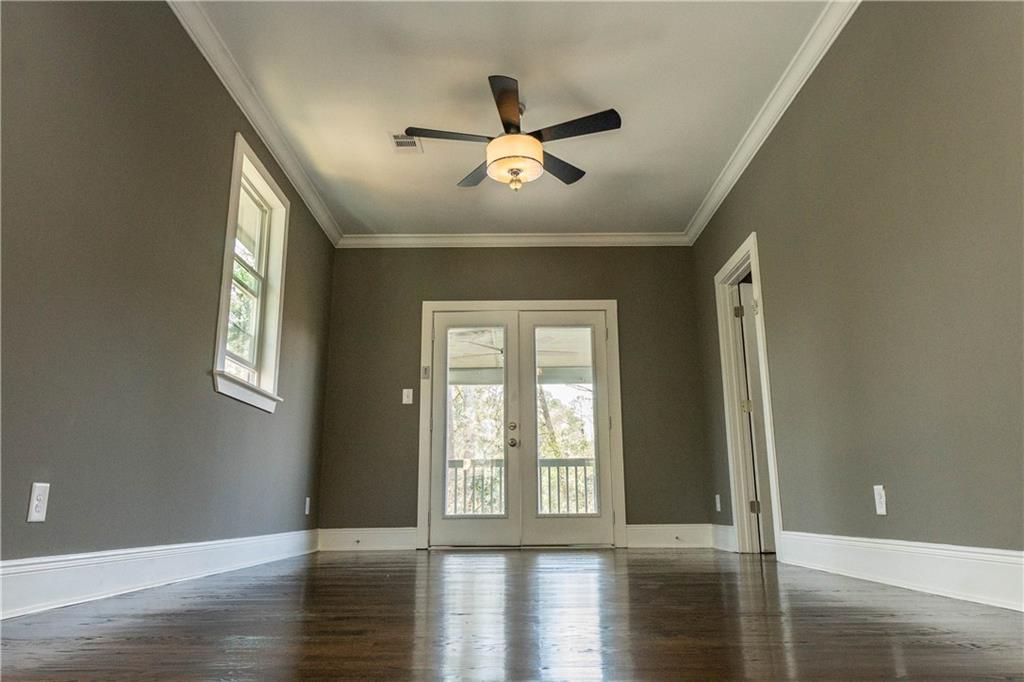 1433 Merriman Lane Northeast Atlanta, GA 30324 - Photo 31 of 60 a view of an empty room with wooden floor and a window