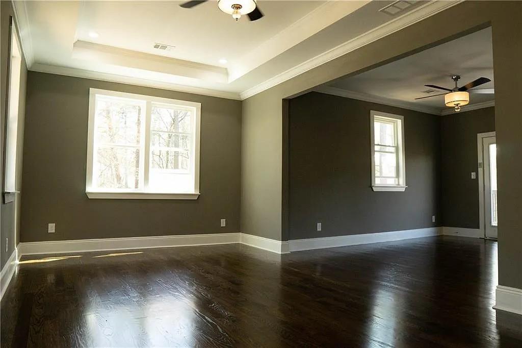 1433 Merriman Lane Northeast Atlanta, GA 30324 - Photo 33 of 60 a view of an empty room with wooden floor and a window