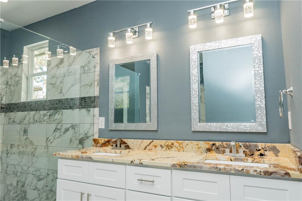 1433 Merriman Lane Northeast Atlanta, GA 30324 - Photo 35 of 60 a bathroom with a sink and a mirror