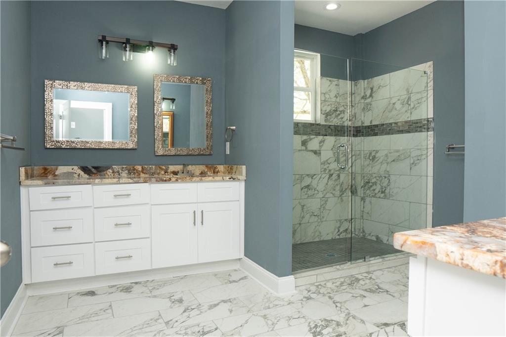 1433 Merriman Lane Northeast Atlanta, GA 30324 - Photo 45 of 60 a bathroom with a sink a toilet and shower