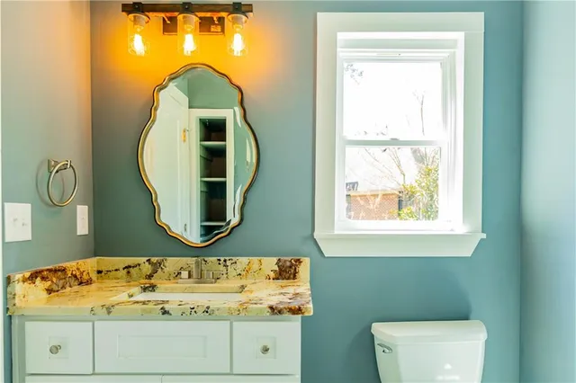 a backyard of a house with barbeque oven and table