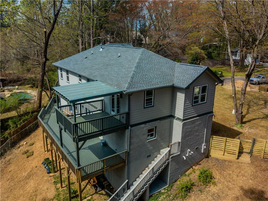 1433 Merriman Lane Northeast Atlanta, GA 30324 - Photo 60 of 60 a backyard of a house with barbeque oven and table