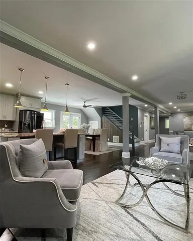 a view of a kitchen with a sink and a large window