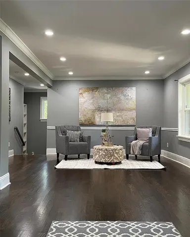 a bathroom with a toilet sink vanity and mirror