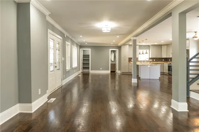 a kitchen with cabinets appliances and a window