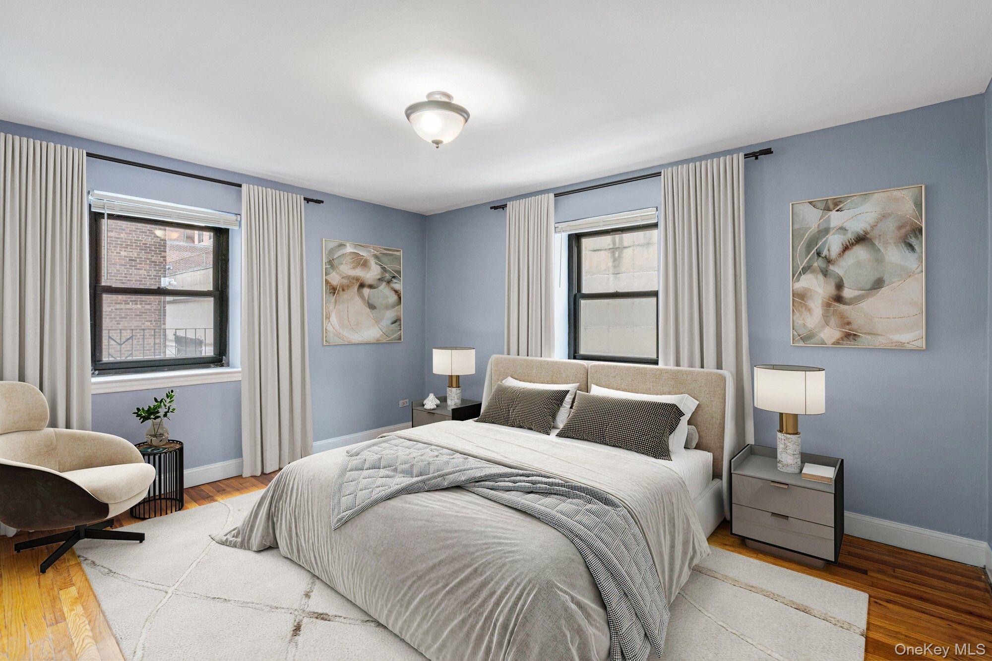 102-55 67th Road, Unit 2V Queens, NY 11375 - Photo 9 of 14 a bedroom with a large bed and a window