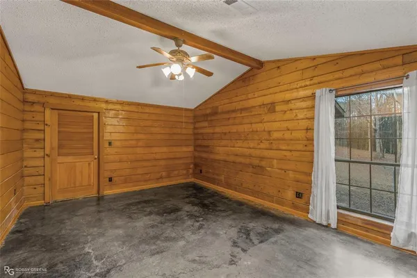 an empty room with fan