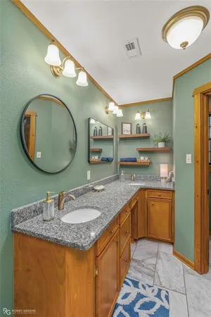 a white bath tub sitting next to a white wall