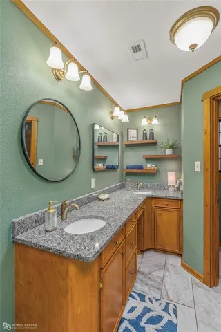 a white bath tub sitting next to a white wall