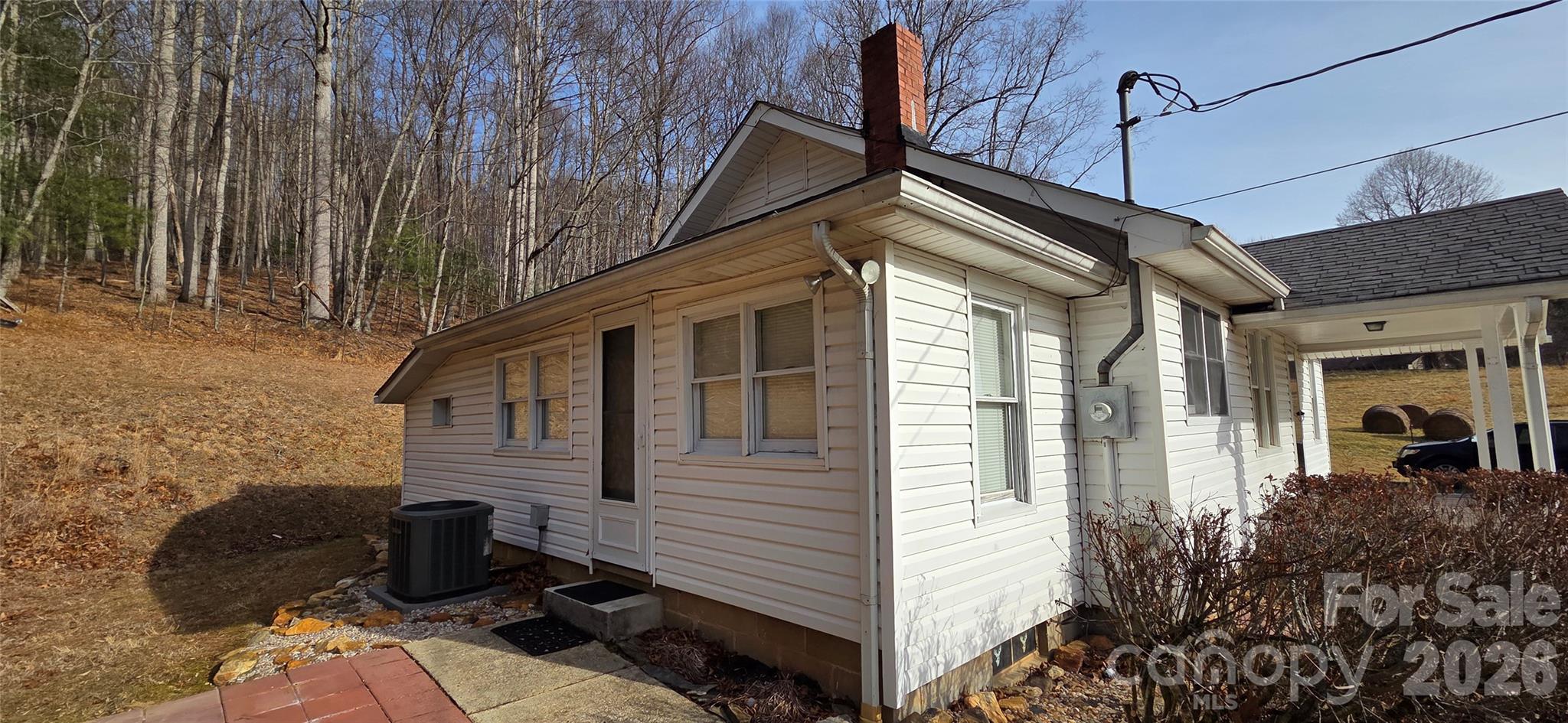 212 Old Dale Road Spruce Pine, NC 28777 - Photo 12 of 30 a view of a house with backyard and sitting area