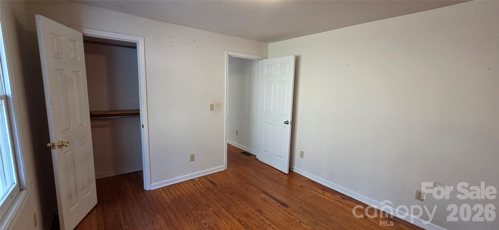 212 Old Dale Road Spruce Pine, NC 28777 - Photo 24 of 30 an empty room with wooden floor and closet