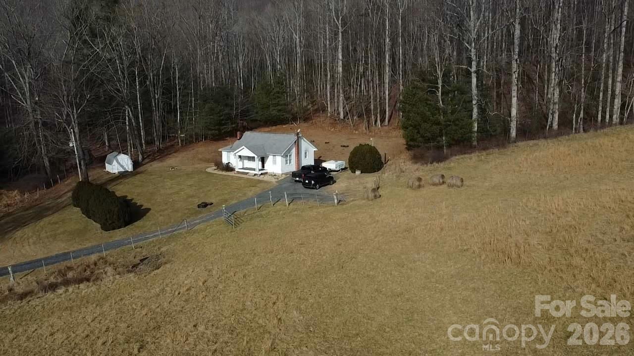212 Old Dale Road Spruce Pine, NC 28777 - Photo 3 of 30 a view of a backyard with table and chairs