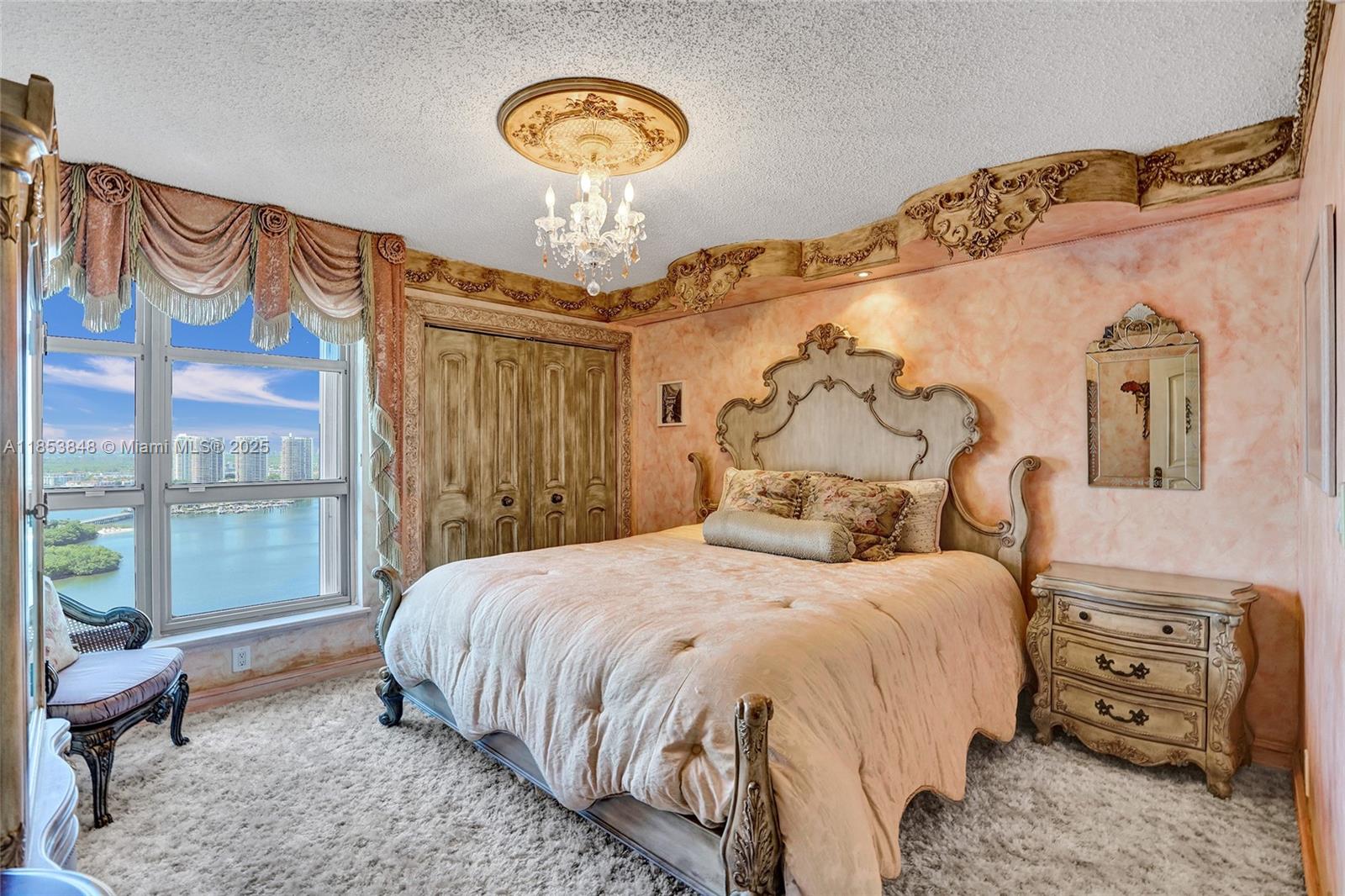 3530 Mystic Pointe Drive, Unit 2915 Aventura, FL 33180 - Photo 13 of 41 a bedroom with a bed and a window