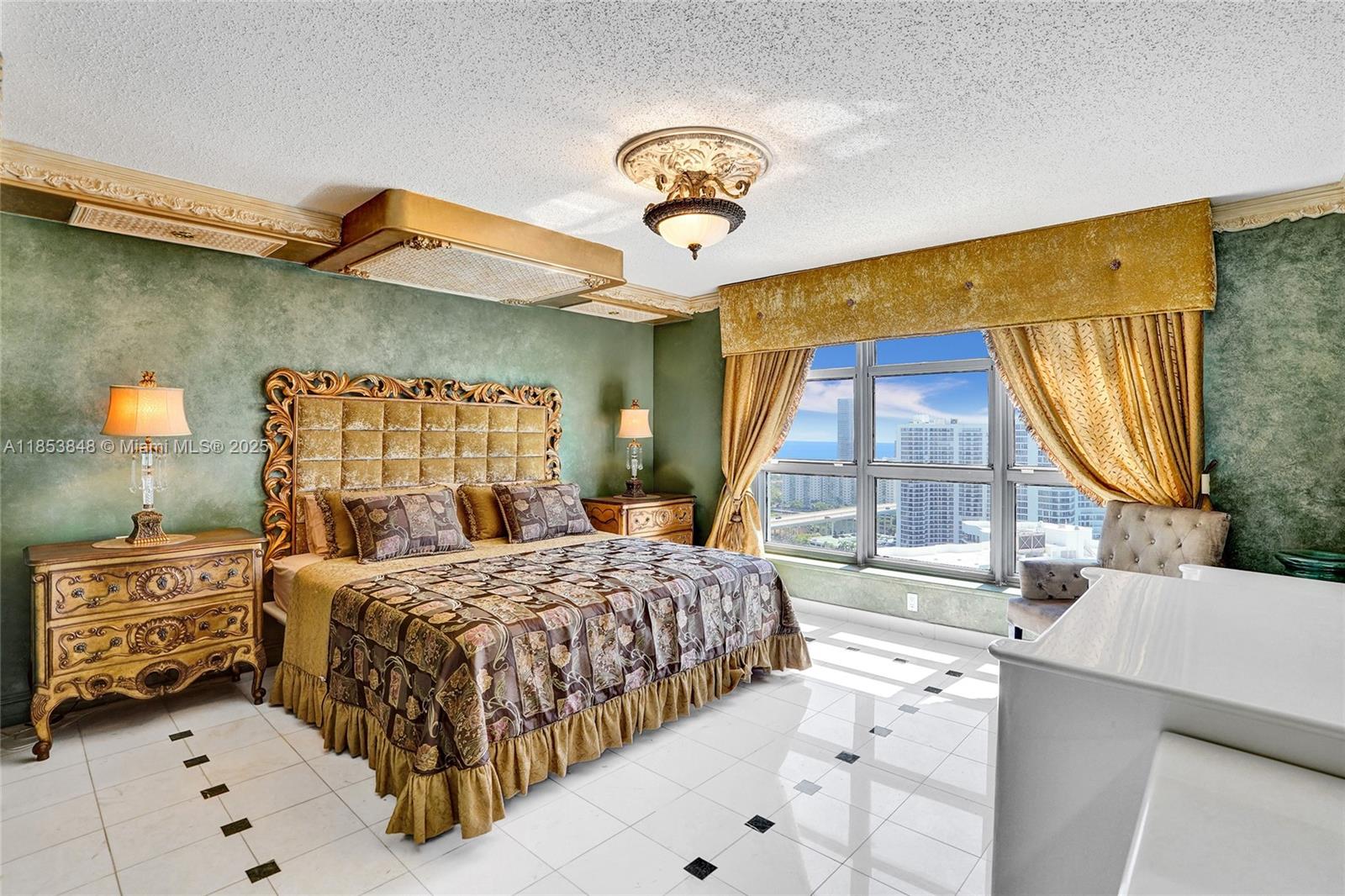 3530 Mystic Pointe Drive, Unit 2915 Aventura, FL 33180 - Photo 15 of 41 a bedroom with a bed a dresser and window