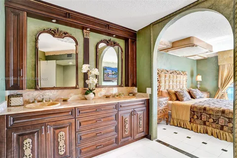 a bathroom with a double vanity sink and a mirror