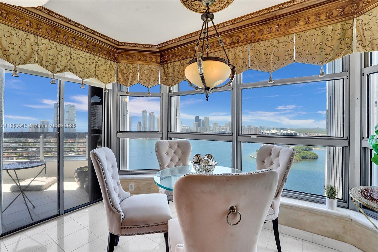 3530 Mystic Pointe Drive, Unit 2915 Aventura, FL 33180 - Photo 3 of 41 a view of a dining room with furniture window and outside view