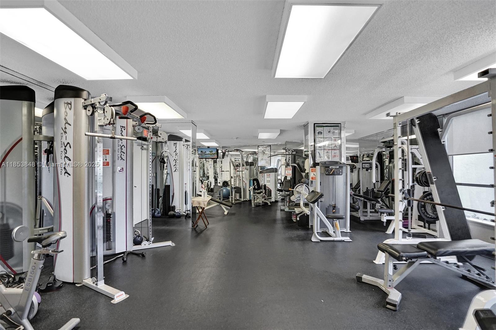 3530 Mystic Pointe Drive, Unit 2915 Aventura, FL 33180 - Photo 32 of 41 a view of a room with gym equipment