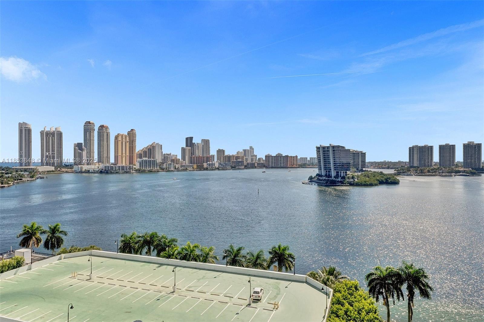 3530 Mystic Pointe Drive, Unit 2915 Aventura, FL 33180 - Photo 34 of 41 a view of a lake with tall buildings