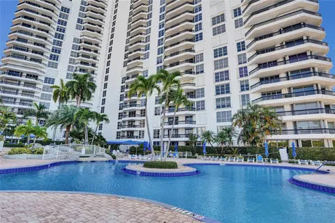 a front view of a building with swimming pool