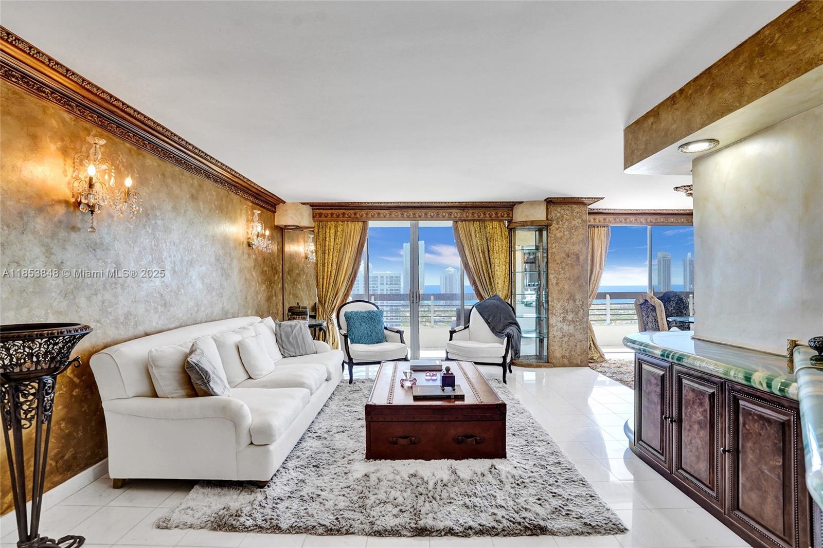 3530 Mystic Pointe Drive, Unit 2915 Aventura, FL 33180 - Photo 5 of 41 a living room with furniture and a large window