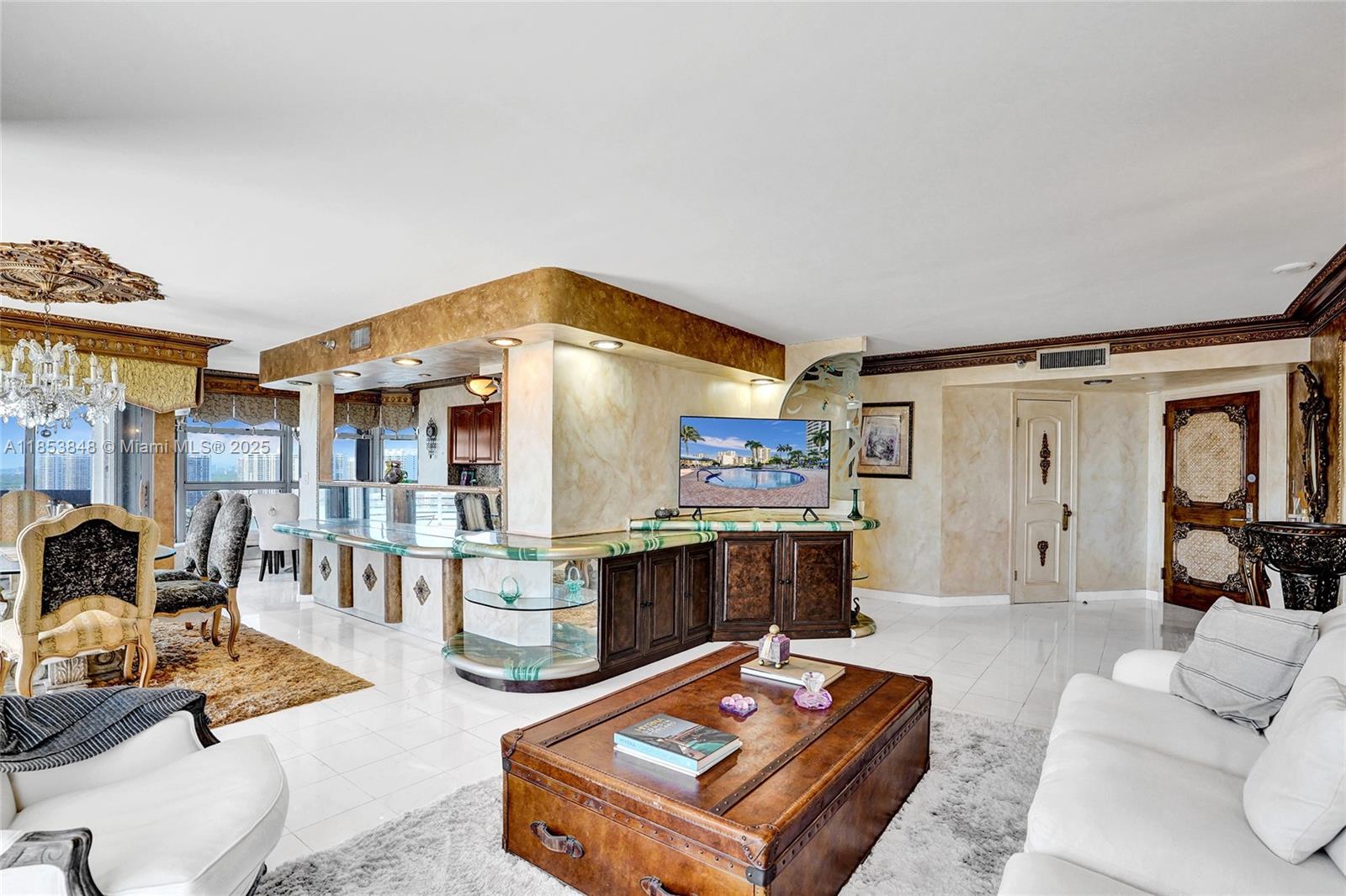 3530 Mystic Pointe Drive, Unit 2915 Aventura, FL 33180 - Photo 8 of 41 a living room with furniture a rug and a table