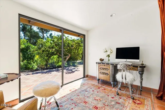 a bathroom with a granite countertop sink a mirror and shower