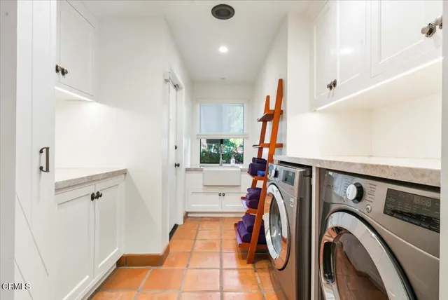 a view of a patio with table and chairs potted plants with wooden floor