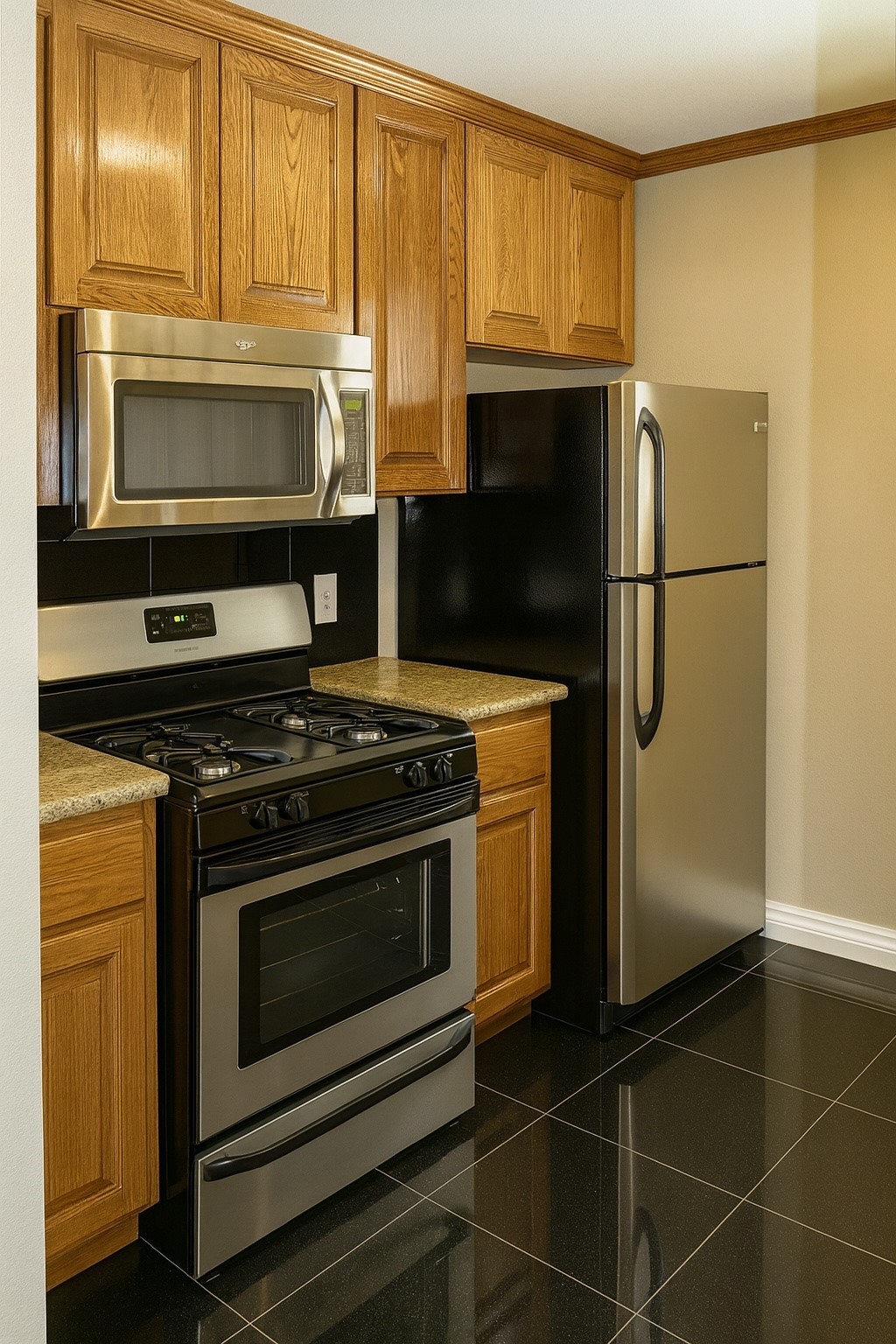 4719 Clay Street, Unit 2 Houston, TX 77023 - Photo 4 of 9 a kitchen with granite countertop a refrigerator stove and microwave