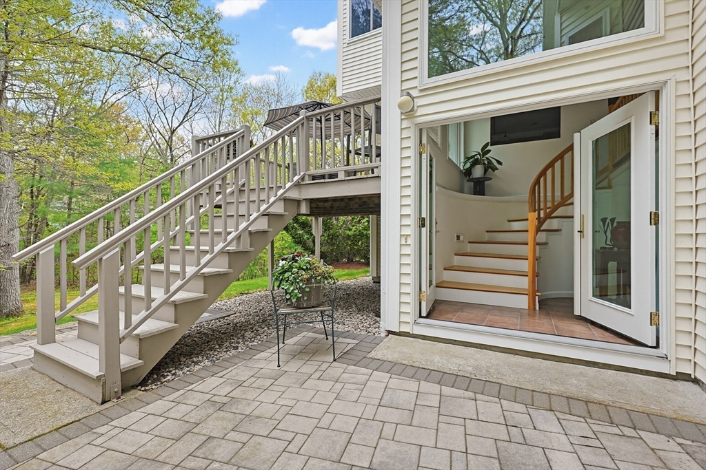 3002 Maple Brook Road, Unit 3002 Bellingham, MA 02019 - Photo 5 of 42 a balcony with chairs and wooden floor