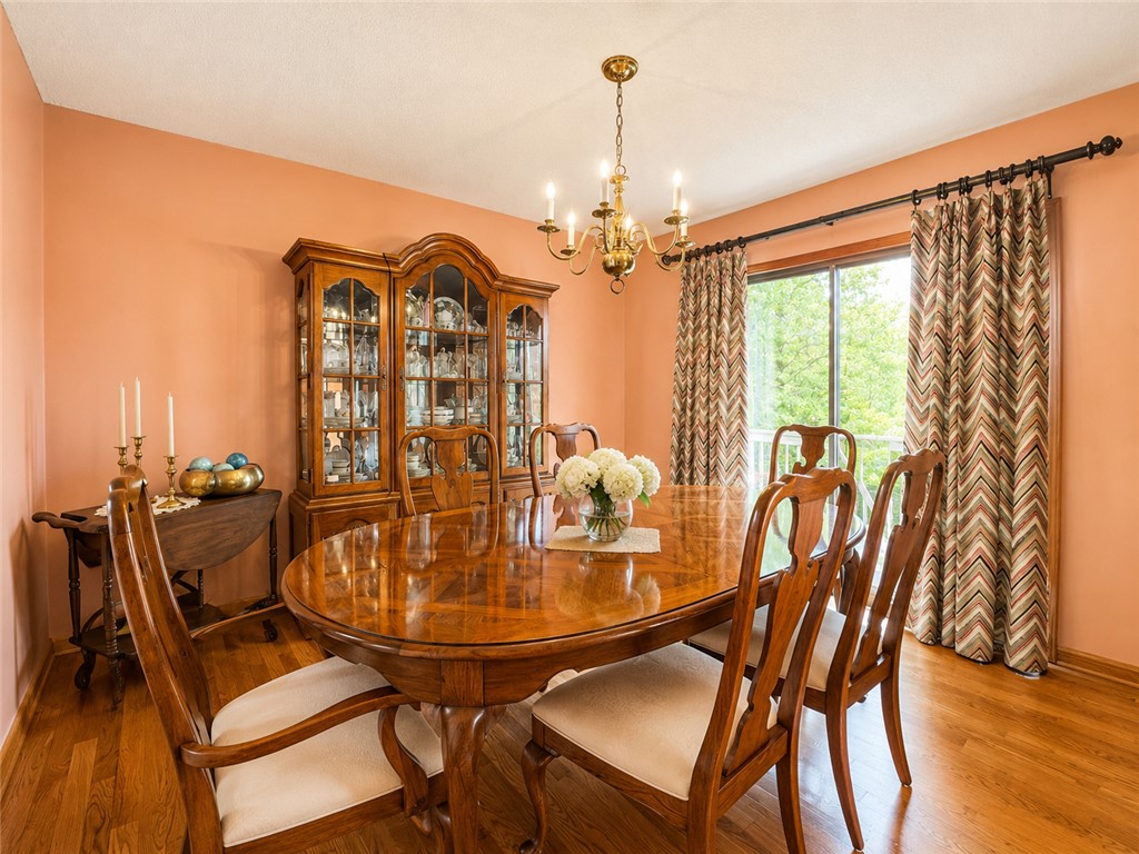 222 Terrace Drive Anderson, SC 29621 - Photo 12 of 37 Hardwood floors and a sophisticated chandelier define this elegant dining space, perfect for memorable gatherings.