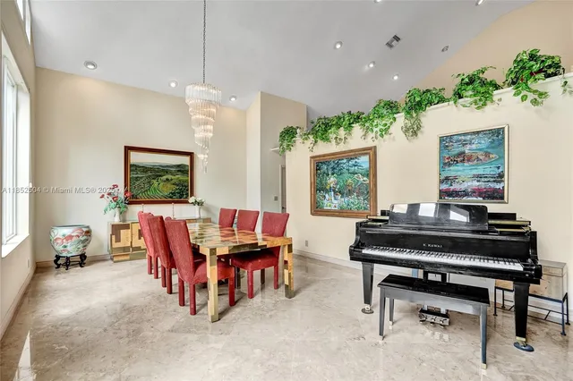 a kitchen with stainless steel appliances wooden cabinets a sink and a large window