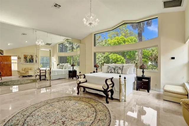 a living room with wooden floor and furniture