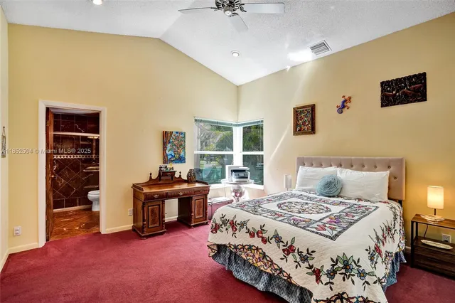 a view of a patio with a table and chairs under an umbrella