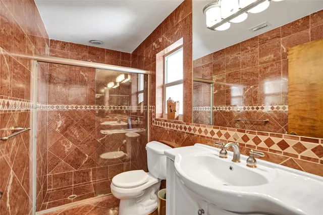 an aerial view of a house with a yard and garden