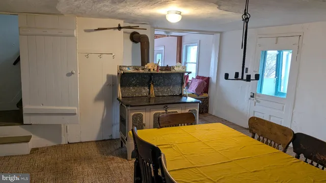 a bedroom with a bed and a table in it