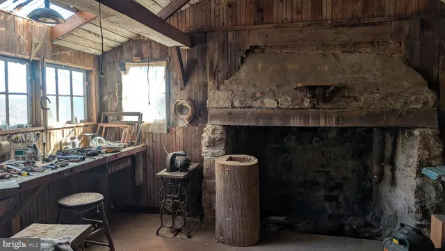 a room with a table chairs and a wooden floor