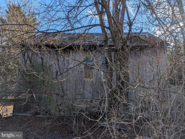 a view of a livingroom with furniture and a window