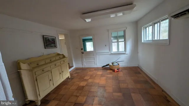 a bedroom with furniture and window