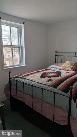 a bedroom with a bed in it