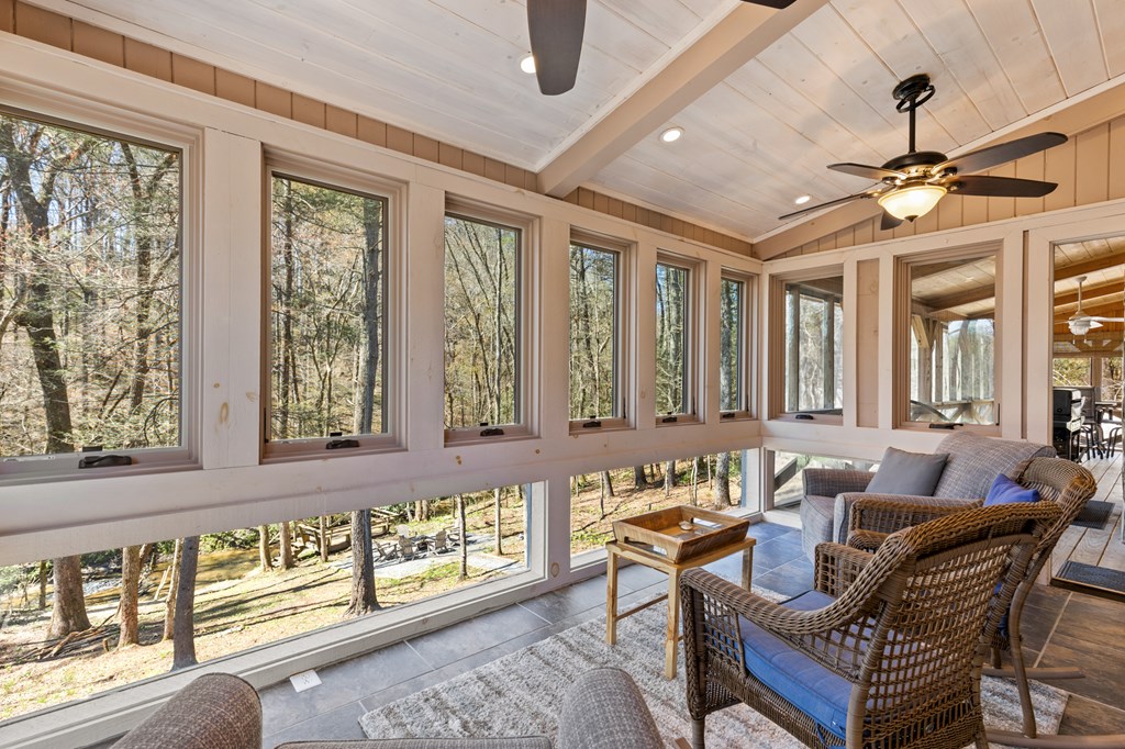 464 Twin Creeks Blue Ridge, GA 30513 - Photo 33 of 61 a dining room with furniture a ceiling fan and a rug